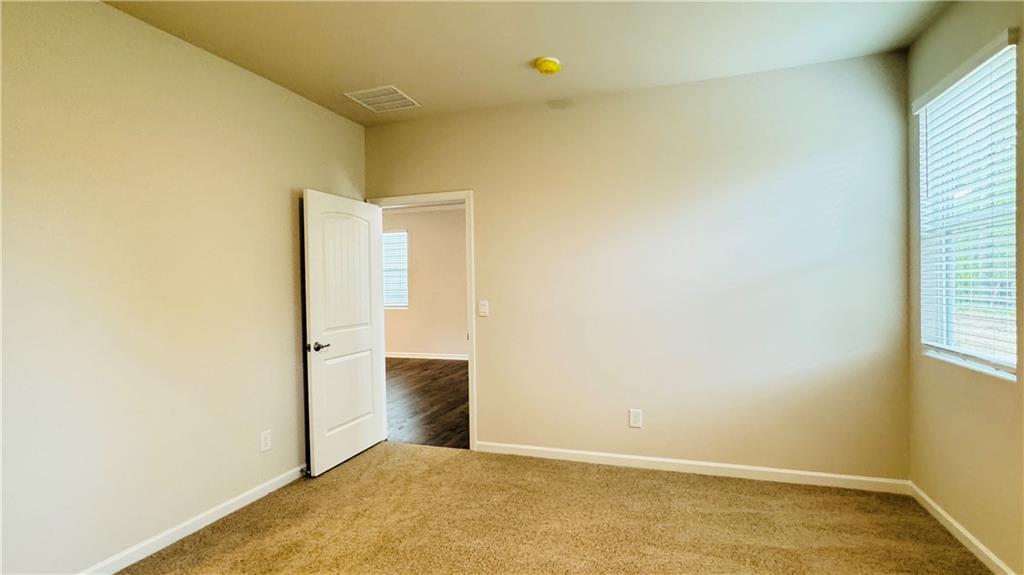 5114 Tulip Square Acworth, GA 30101 - Photo 15 of 36 an empty room with wooden floor and windows