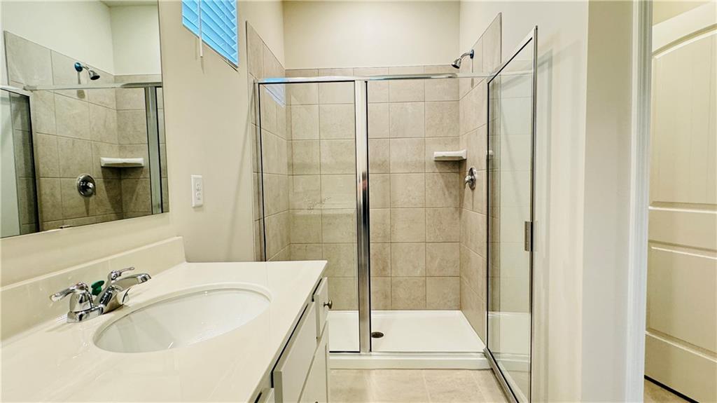 5114 Tulip Square Acworth, GA 30101 - Photo 19 of 36 a bathroom with a shower and a sink