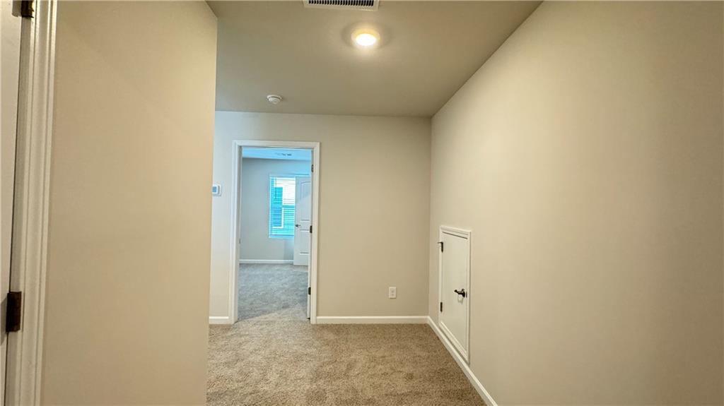 5114 Tulip Square Acworth, GA 30101 - Photo 25 of 36 a view of a hallway with wooden floor