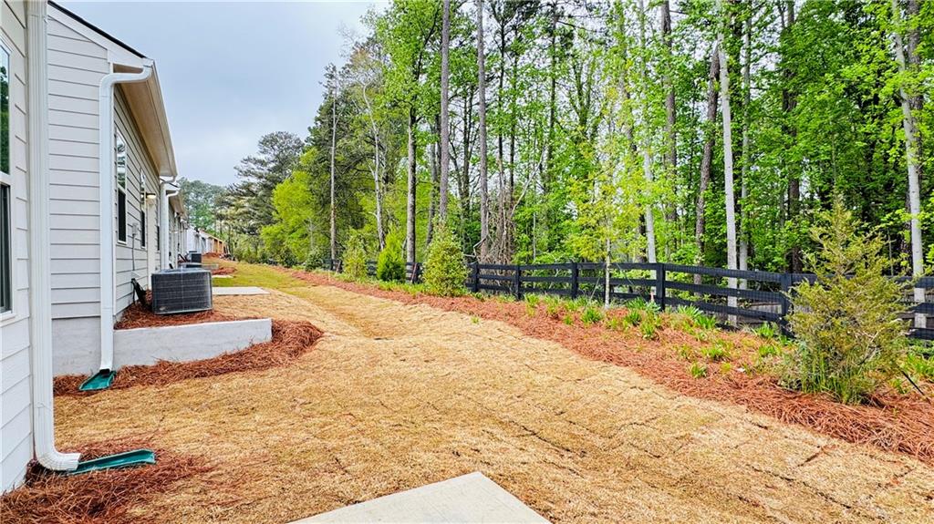 5114 Tulip Square Acworth, GA 30101 - Photo 30 of 36 a view of a backyard with plants and trees
