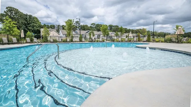 a view of a swimming pool and an outdoor space