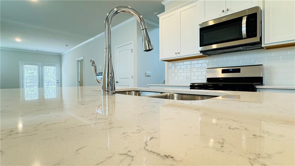 5114 Tulip Square Acworth, GA 30101 - Photo 7 of 36 a view of a kitchen with an oven