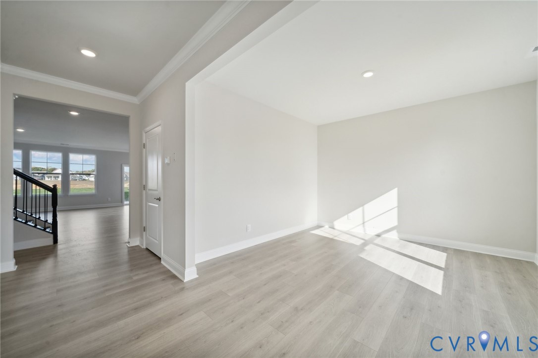 16801 Copperland Point Chesterfield, VA 23832 - Photo 5 of 17 an empty room with wooden floor and windows
