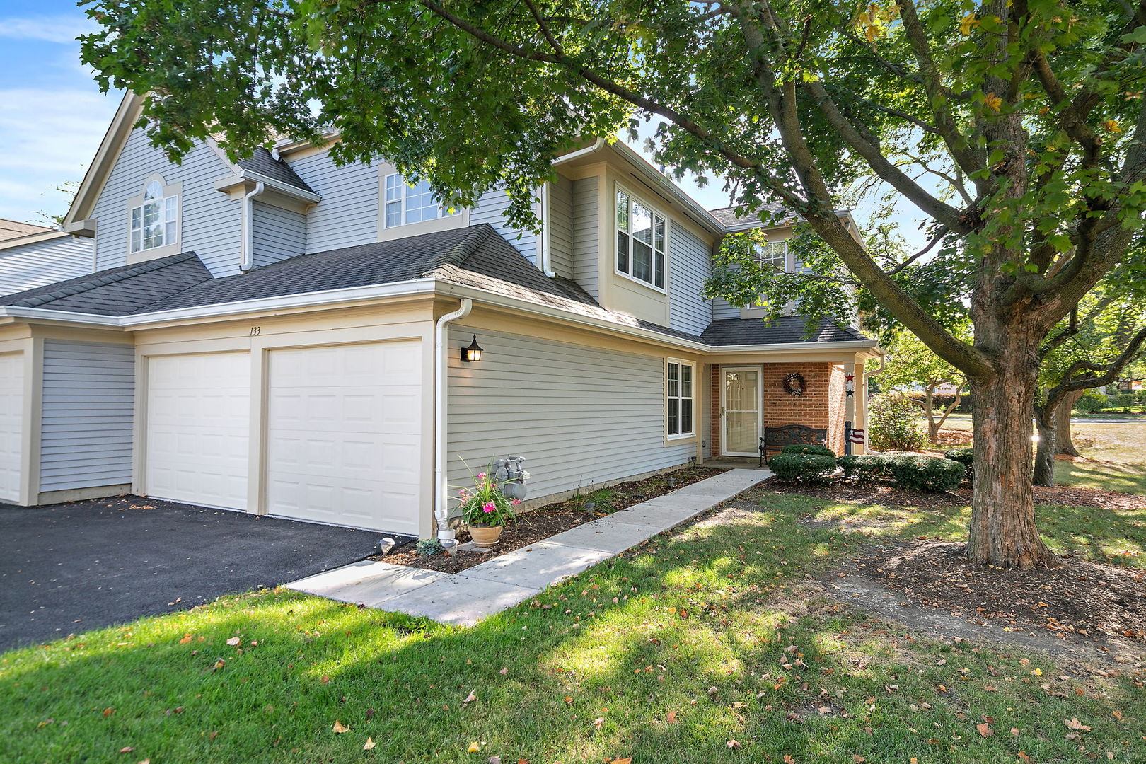 front view of a house with a yard