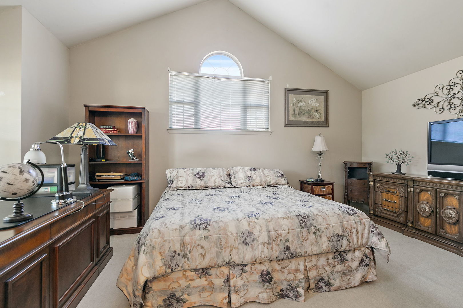 133 White Branch Court South, Unit 133 Schaumburg, IL 60107 - Photo 16 of 27 a bedroom with a bed and a flat screen tv