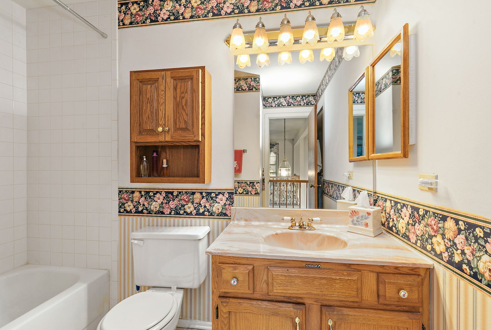133 White Branch Court South, Unit 133 Schaumburg, IL 60107 - Photo 21 of 27 a bathroom with a sink and a mirror