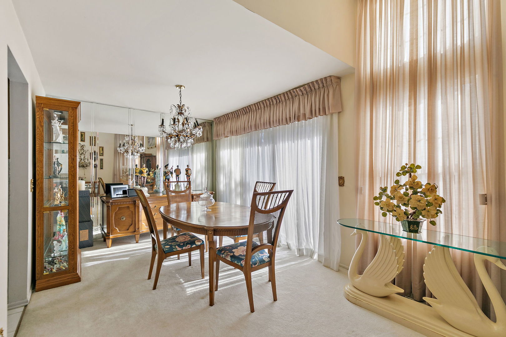 133 White Branch Court South, Unit 133 Schaumburg, IL 60107 - Photo 7 of 27 a view of a dining room with furniture and chandelier