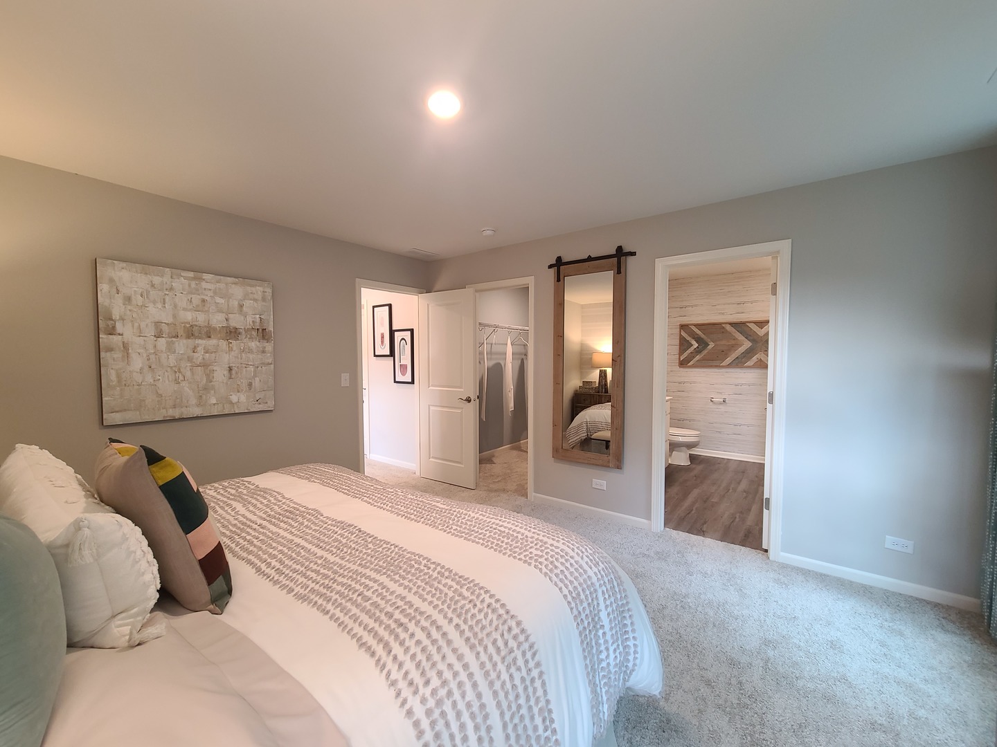 1214 Draper Road McHenry, IL 60050 - Photo 17 of 33 a bedroom with a bed and a chandelier