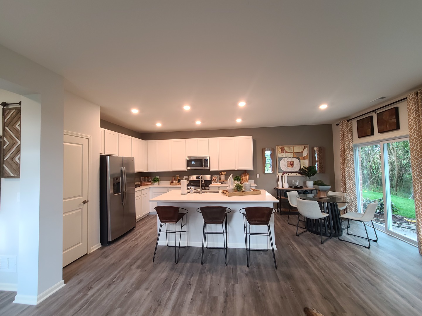 1214 Draper Road McHenry, IL 60050 - Photo 7 of 33 a view of a dining room with furniture window and wooden floor