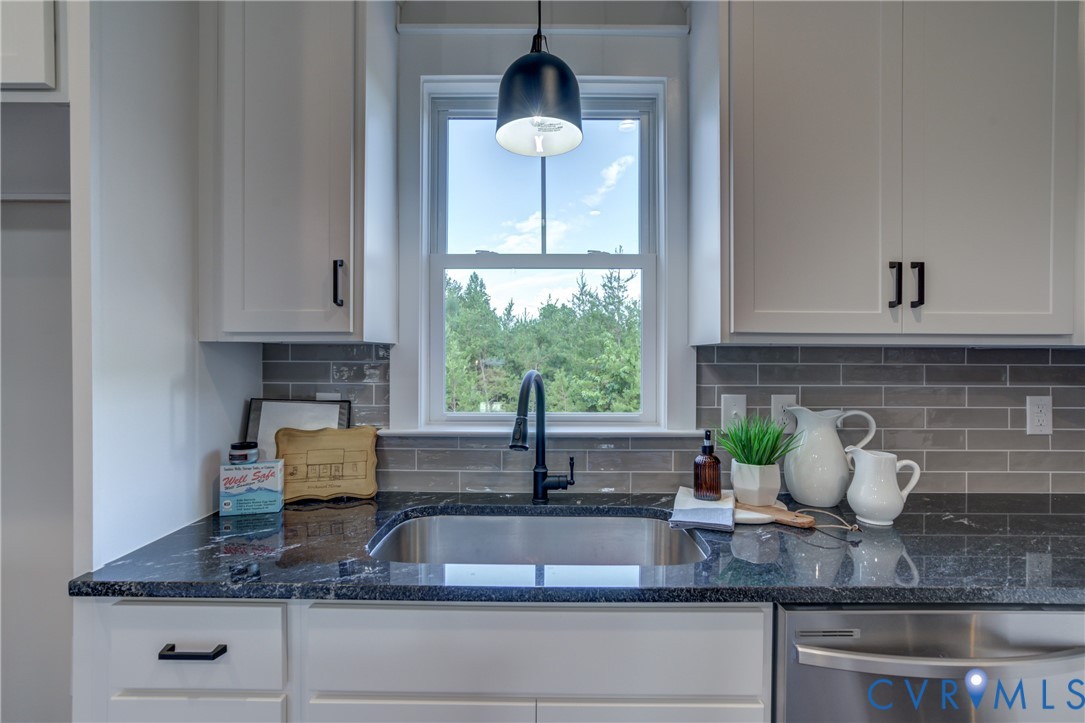 5306 St Pauls Church Road Goochland, VA 23063 - Photo 20 of 35 a kitchen with granite countertop a potted plant on the granite countertops and a sink