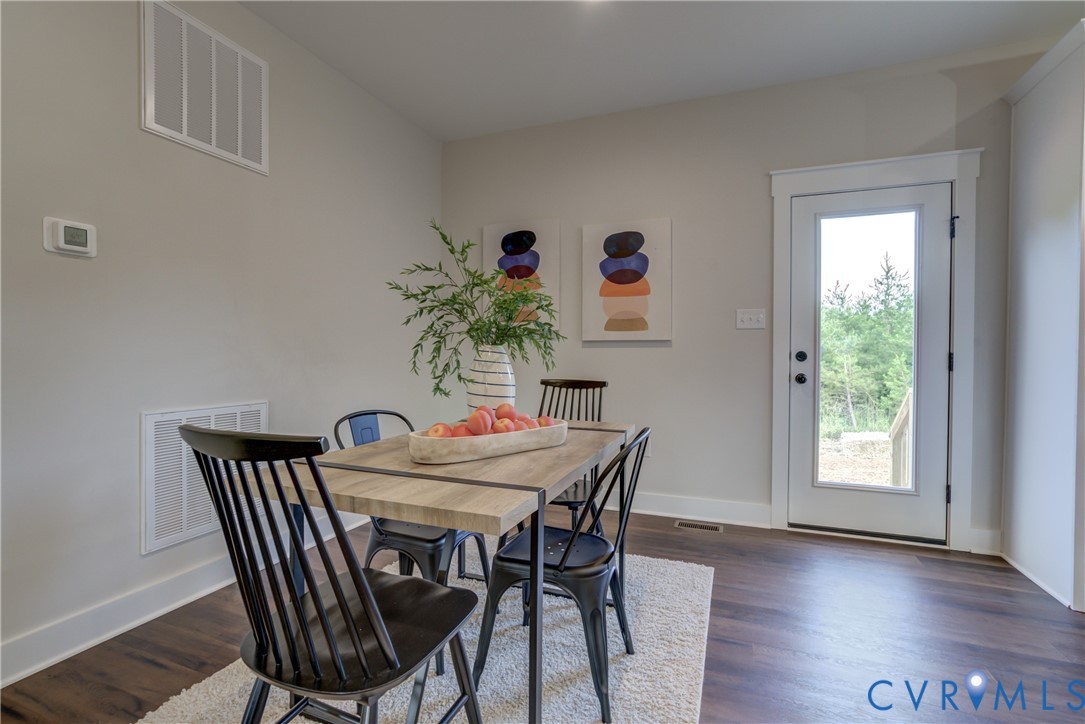 5306 St Pauls Church Road Goochland, VA 23063 - Photo 23 of 35 a view of a dining room with furniture and wooden floor