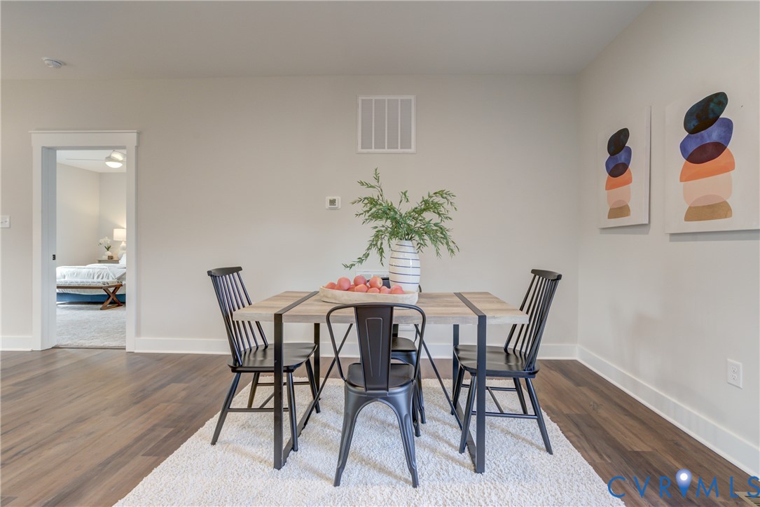 5306 St Pauls Church Road Goochland, VA 23063 - Photo 24 of 35 a view of a dining room with furniture and wooden floor