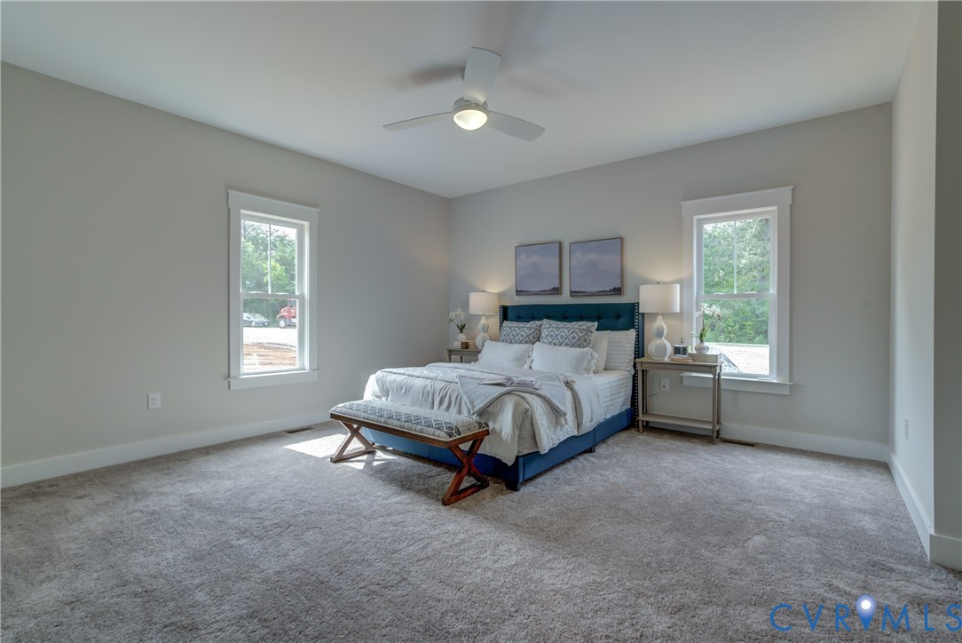 5306 St Pauls Church Road Goochland, VA 23063 - Photo 25 of 35 a bed sitting in a spacious bedroom next to a window