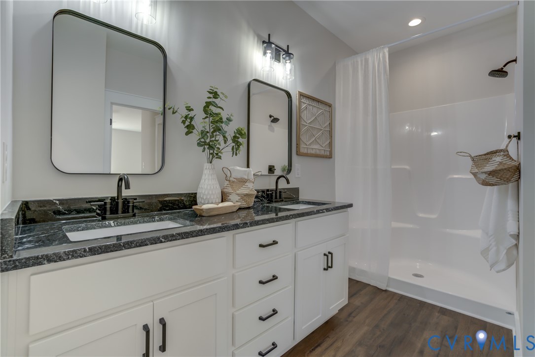 5306 St Pauls Church Road Goochland, VA 23063 - Photo 28 of 35 a bathroom with double vanity sinks and a mirror