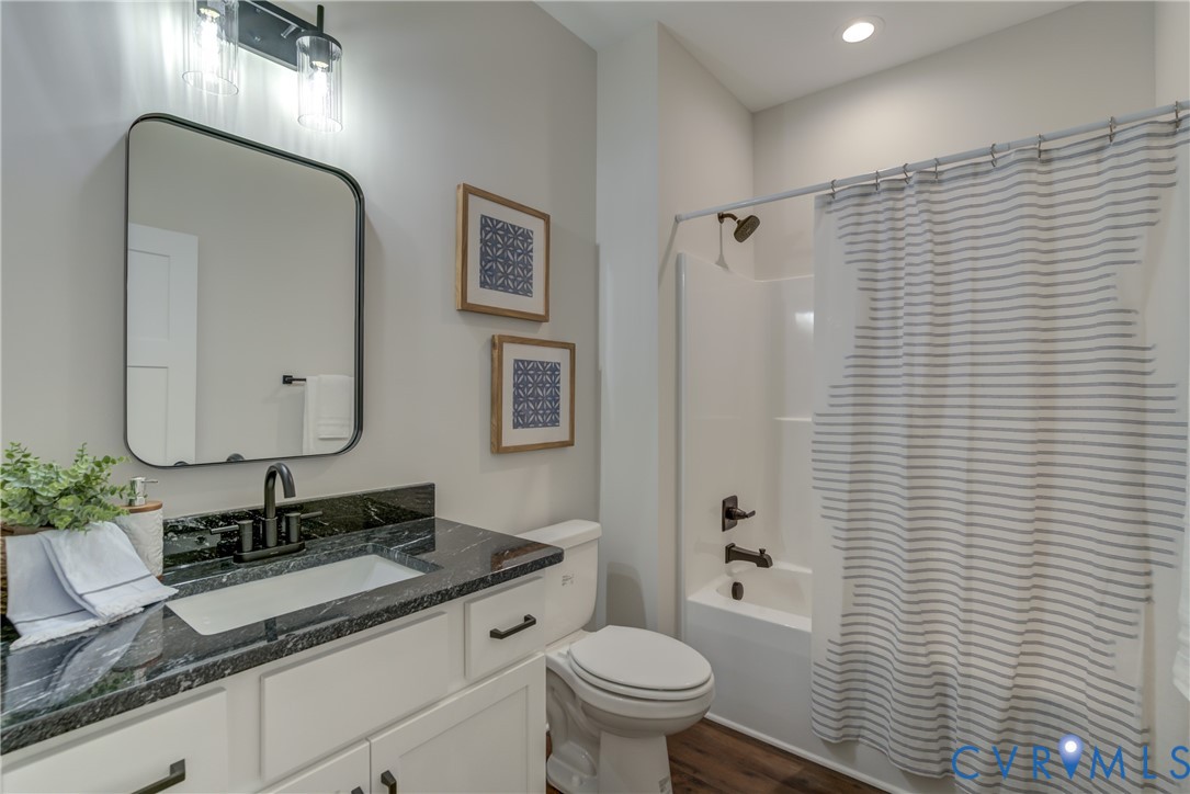 5306 St Pauls Church Road Goochland, VA 23063 - Photo 32 of 35 a bathroom with a granite countertop sink toilet and shower