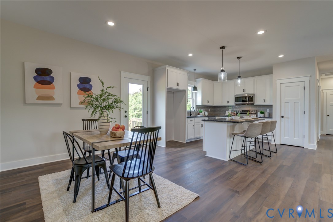 5306 St Pauls Church Road Goochland, VA 23063 - Photo 7 of 35 a view of a dining room with furniture and wooden floor