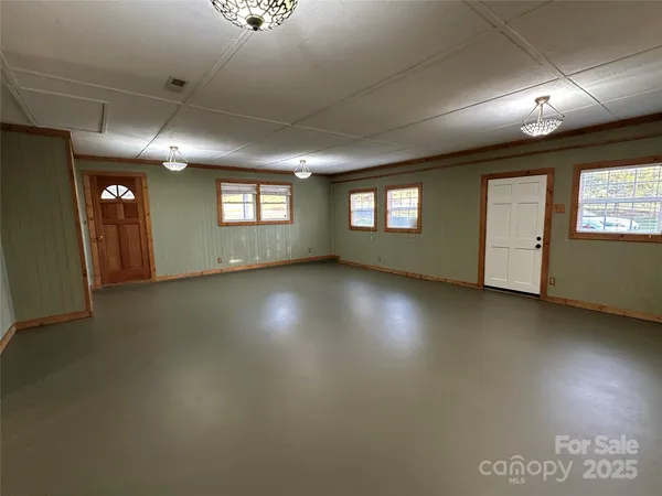 a view of an empty room with windows
