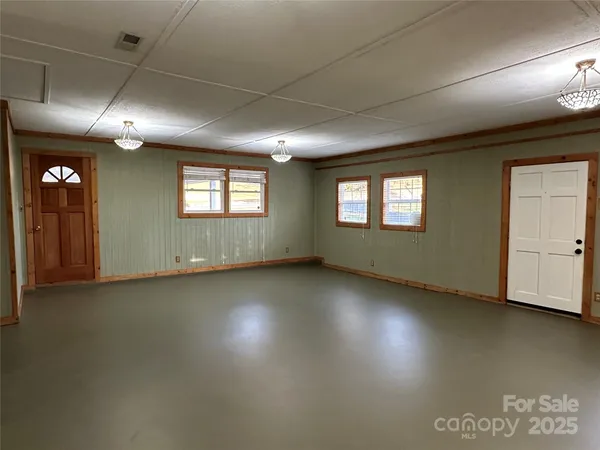 a view of an empty room with a window