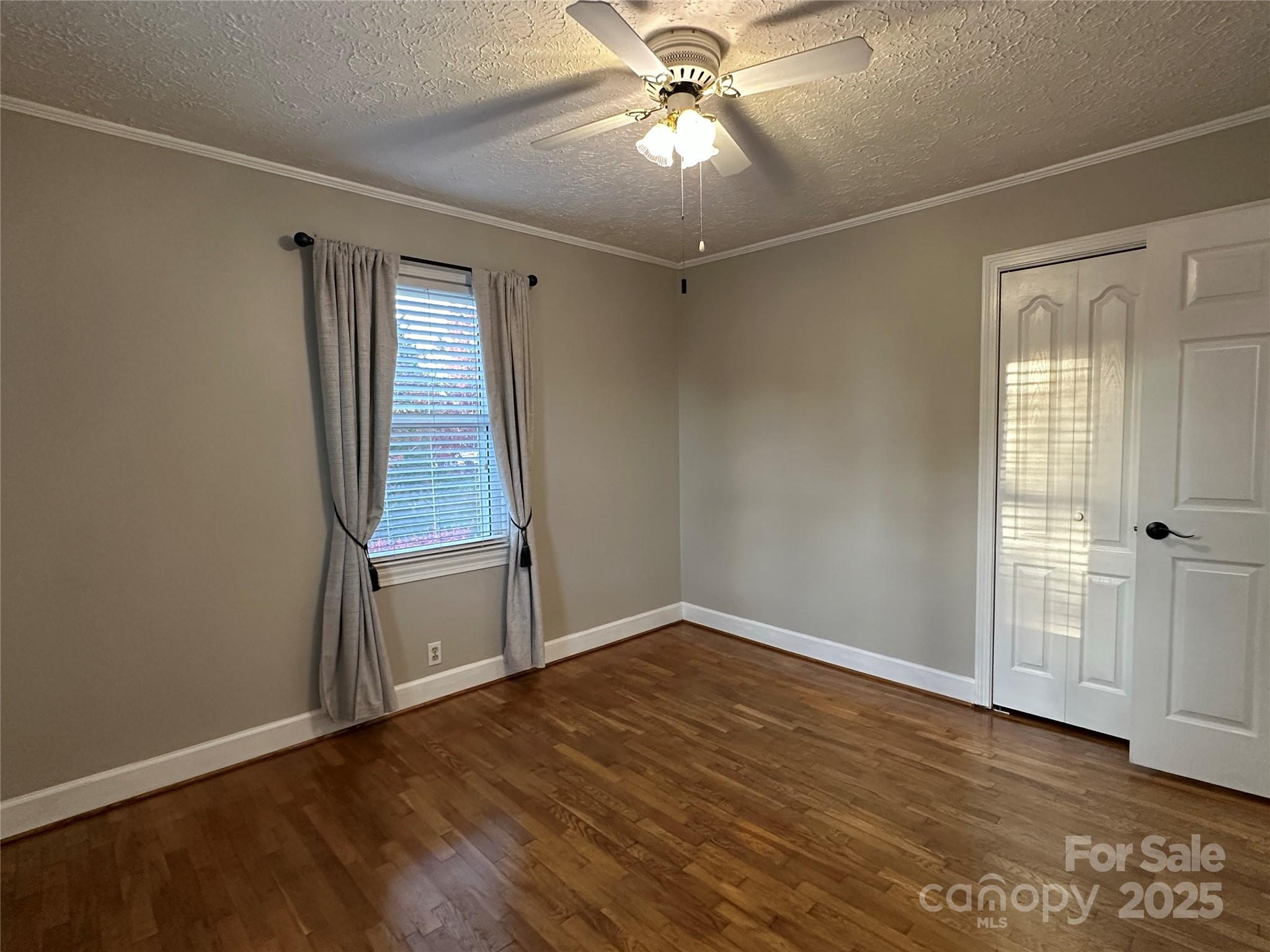 2945 Freezer Locker Road Hudson, NC 28638 - Photo 24 of 38 a view of an empty room with wooden floor and a window