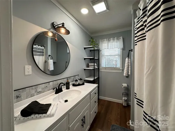 a bathroom with a sink and a mirror