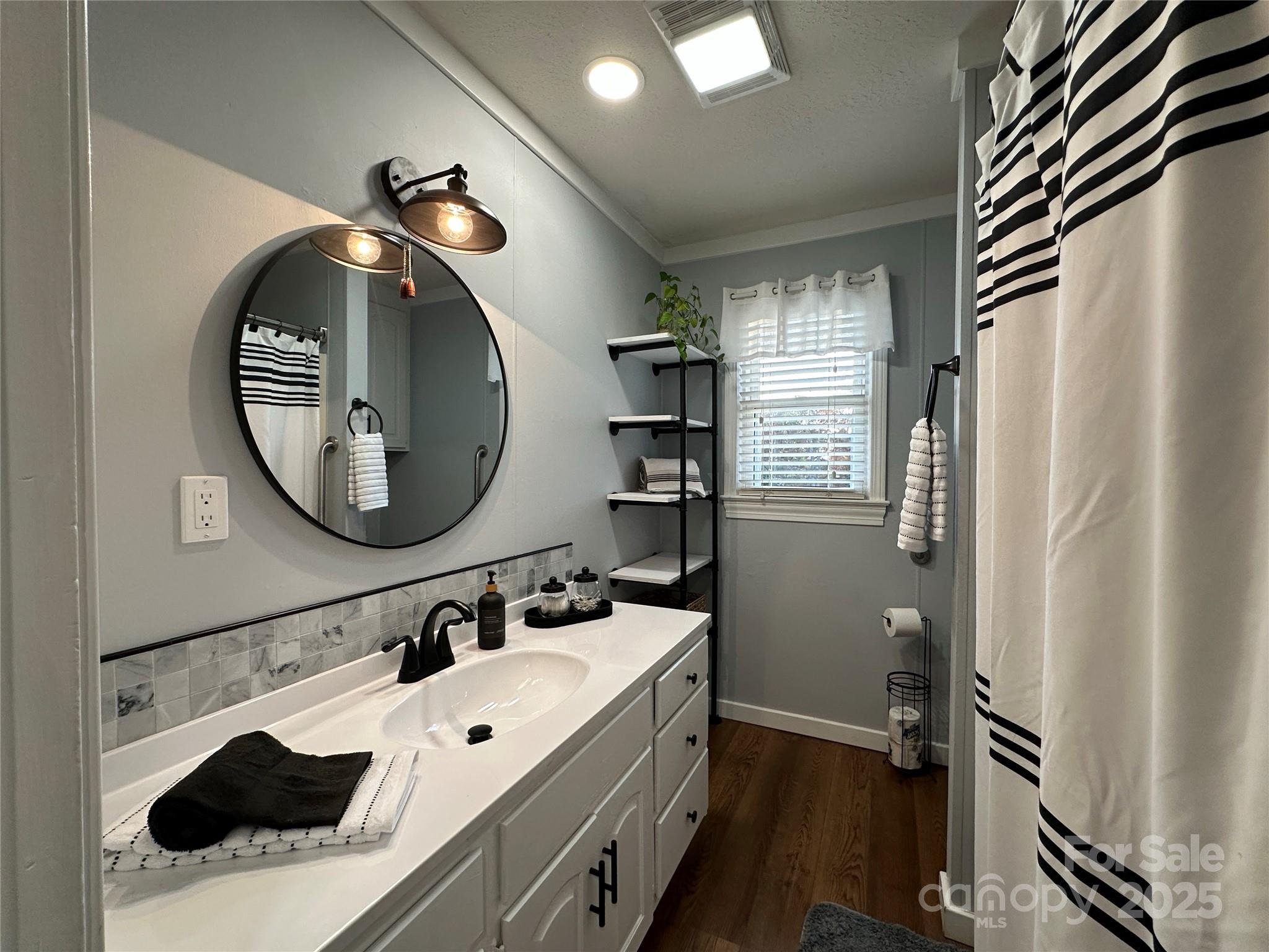 2945 Freezer Locker Road Hudson, NC 28638 - Photo 27 of 38 a bathroom with a sink and a mirror