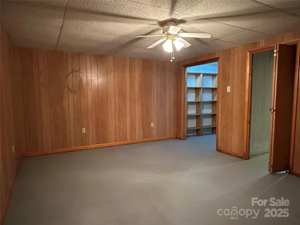 an empty room with closet area