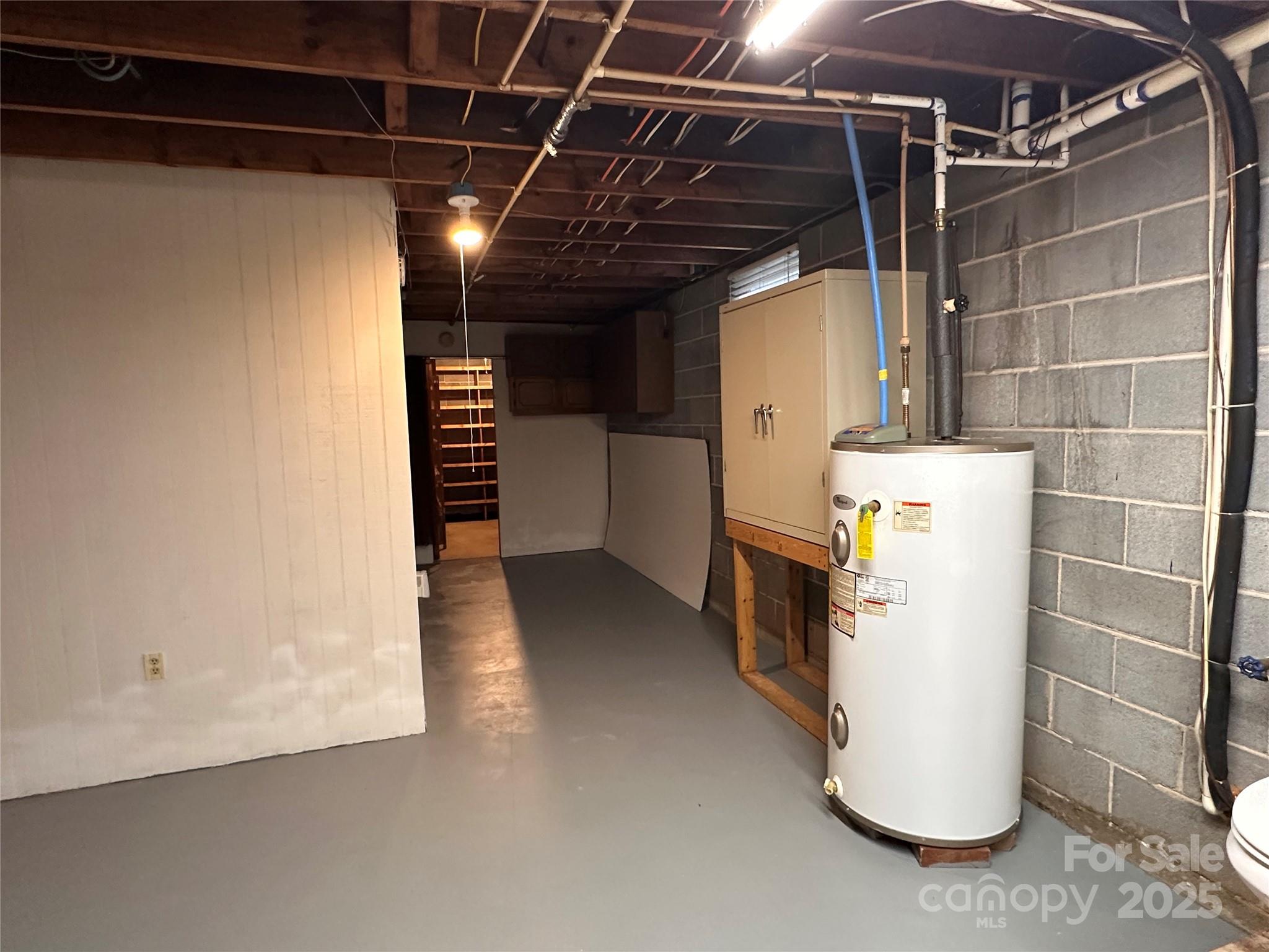 2945 Freezer Locker Road Hudson, NC 28638 - Photo 33 of 38 a view of storage and utility room with stairs and washer
