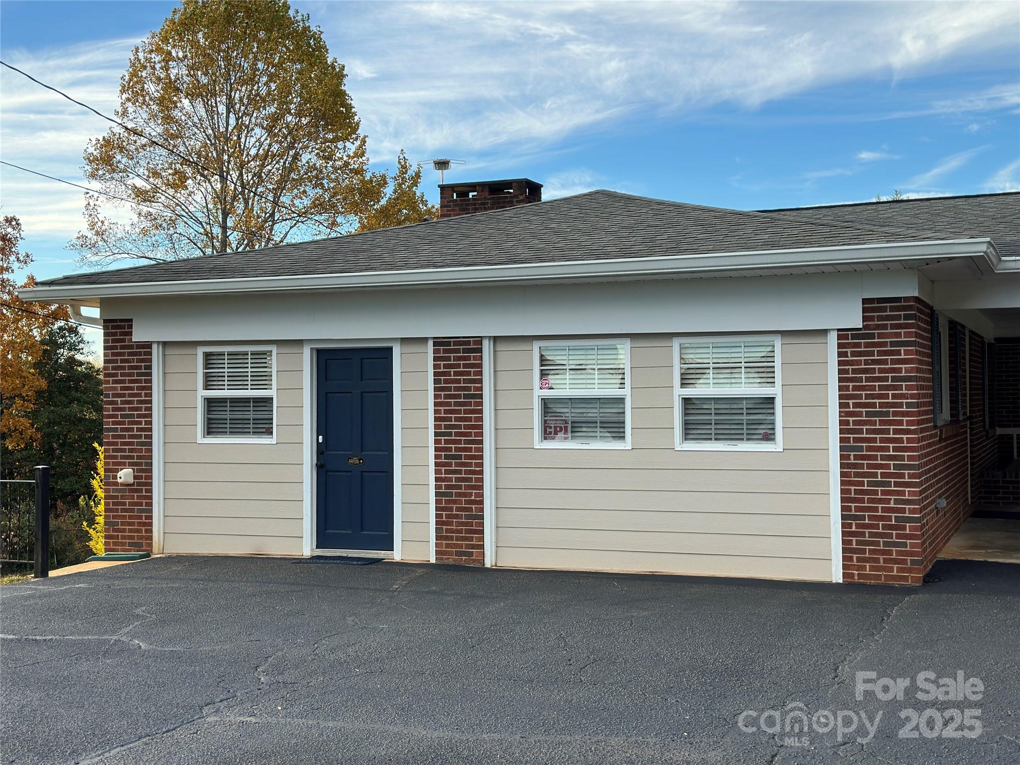 2945 Freezer Locker Road Hudson, NC 28638 - Photo 7 of 38 a view of a house with a large window and a yard