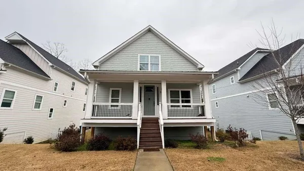 a view of house and fire pit