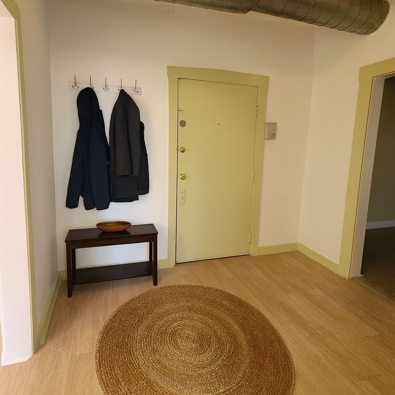 3301 West Potomac Avenue, Unit G Chicago, IL 60651 - Photo 12 of 18 a view of a room with a bed and wooden floor