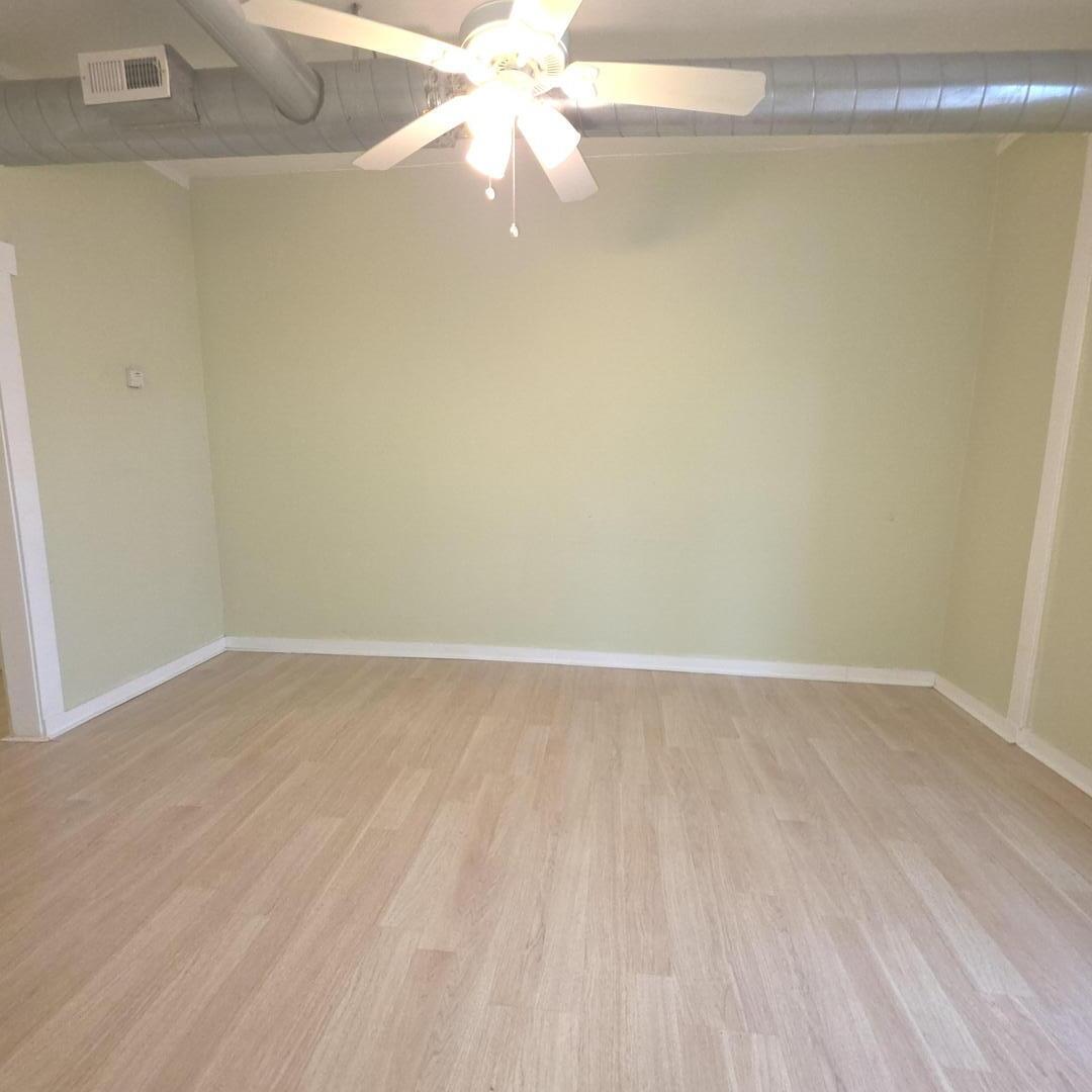 3301 West Potomac Avenue, Unit G Chicago, IL 60651 - Photo 8 of 18 a view of a room with wooden floor