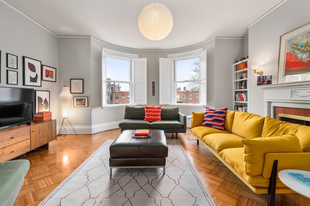 49 Garrison Road Brookline, MA 02445 - Photo 13 of 25 a living room with furniture and a flat screen tv