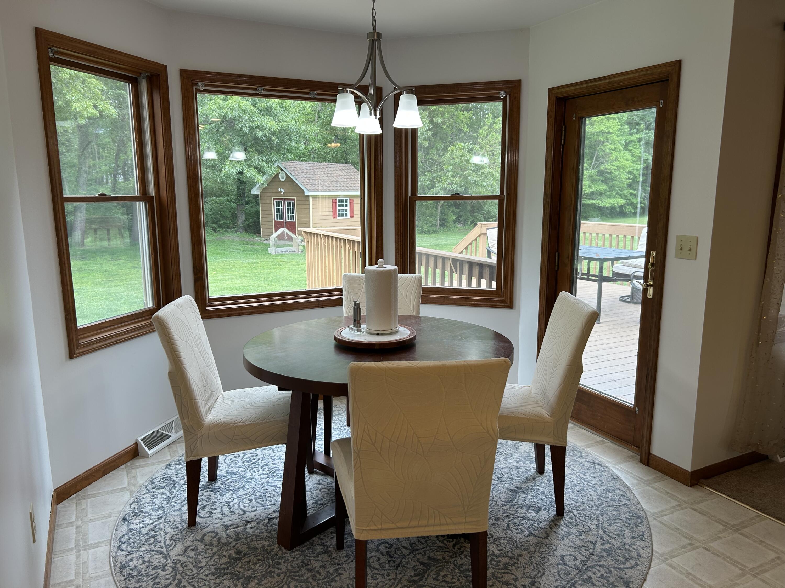 8876 North Lilac Street Demotte, IN 46310 - Photo 11 of 23 a dining room with furniture window and outside view
