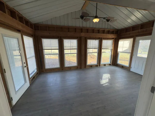 a view of entryway and hallway with wooden floor
