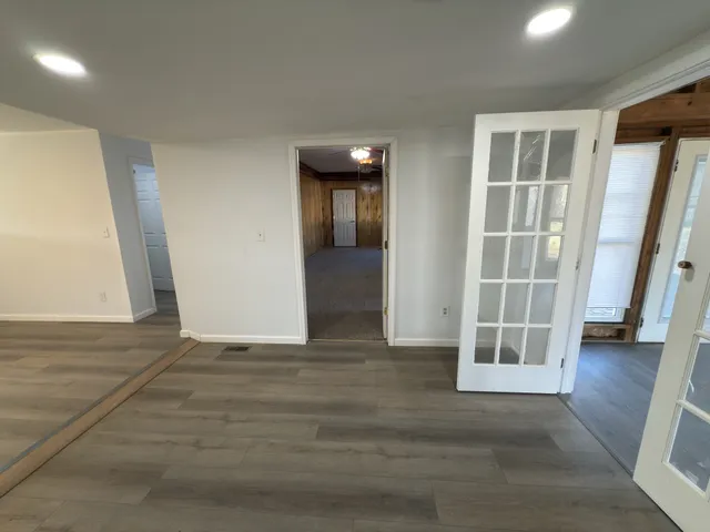 a kitchen with kitchen island a sink appliances and cabinets