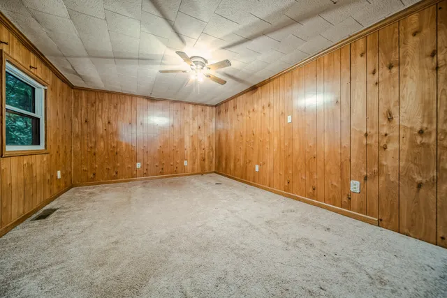 a kitchen with stainless steel appliances granite countertop a lot of cabinets