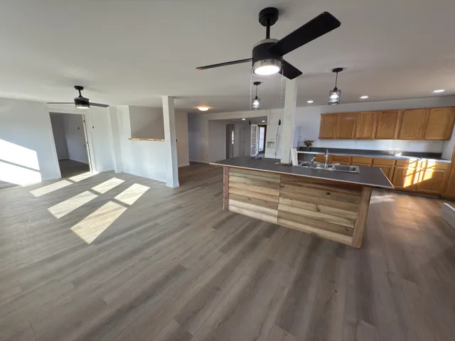 a kitchen with stainless steel appliances granite countertop a stove and a refrigerator