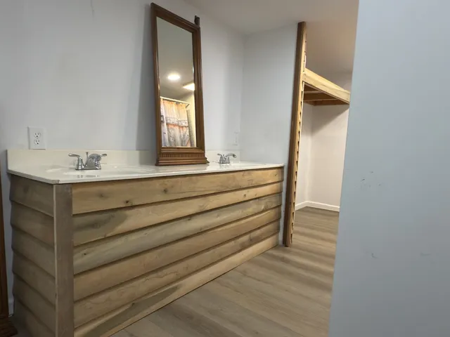 a bathroom with a granite countertop shower and a toilet