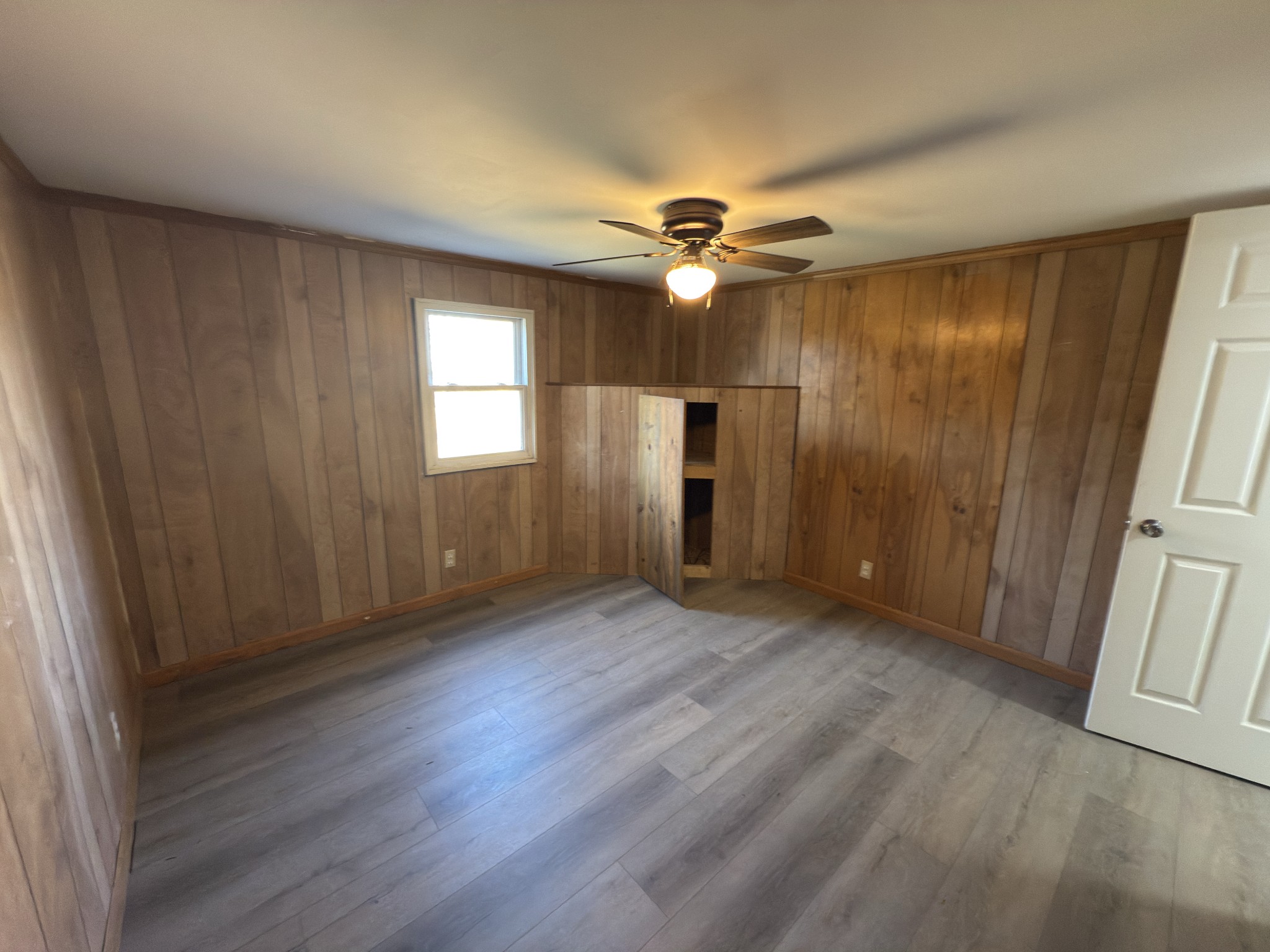 2000 Myers Cove Road McMinnville, TN 37110 - Photo 56 of 76 a view of empty room with wooden floor and fan