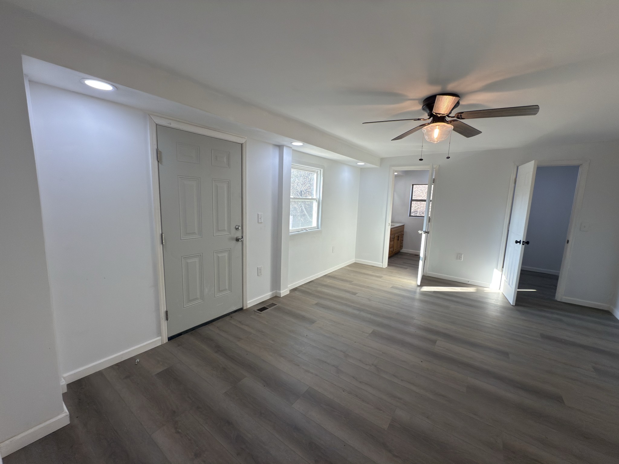 2000 Myers Cove Road McMinnville, TN 37110 - Photo 65 of 76 a view of an empty room with wooden floor and a ceiling fan