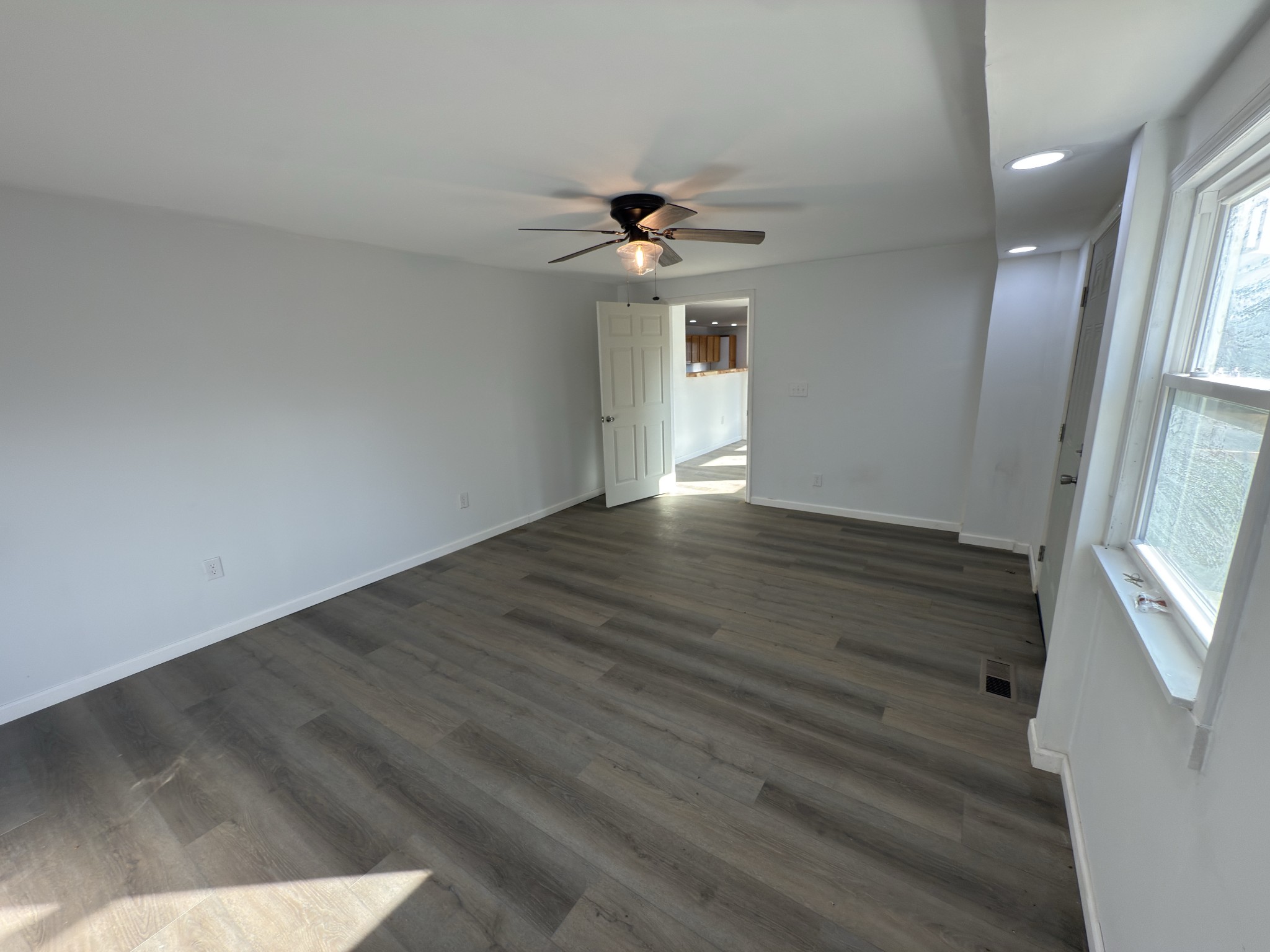 2000 Myers Cove Road McMinnville, TN 37110 - Photo 70 of 76 an empty room with wooden floor and windows