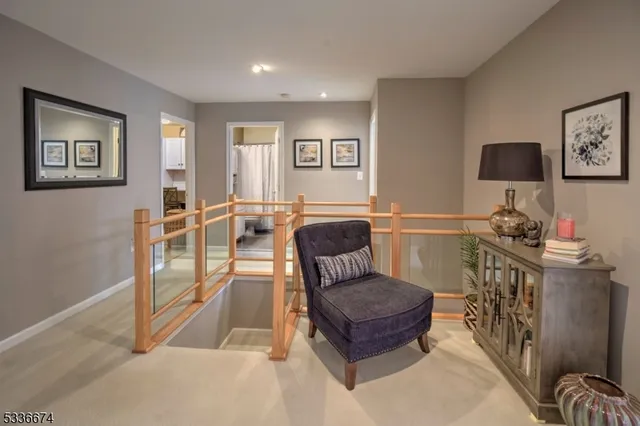 a living room with furniture a couch and a flat screen tv