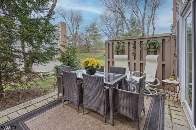 a view of balcony with two chairs and a table