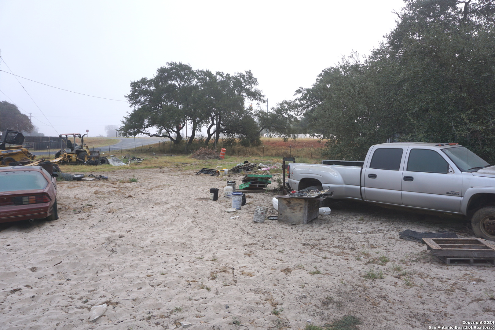47 Viewpoint Drive Poteet, TX 78065 - Photo 11 of 20 a view of a backyard with a table and chairs