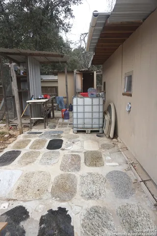 a building outdoor space with patio furniture and a tub