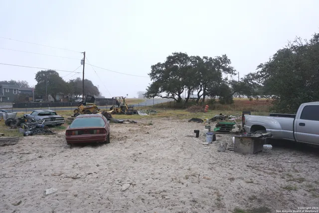 a view of a lake with a parked cars
