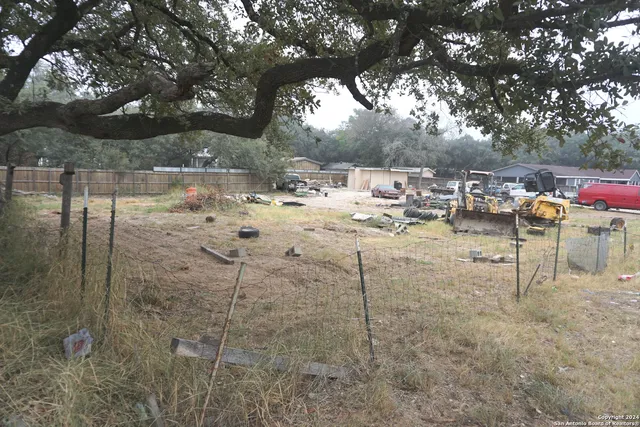 a view of a yard with table and chairs