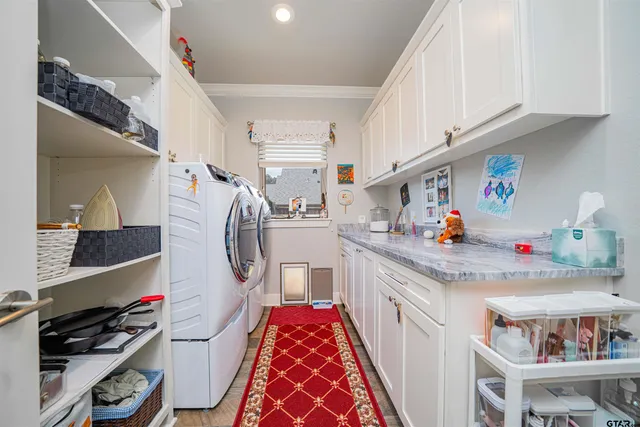 a utility room with sink dryer and washer