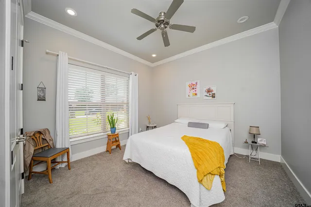 a bed room with a bed and a chair