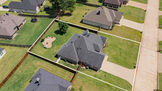 an aerial view of a house with a garden